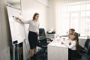 Teacher supporting students in a classroom