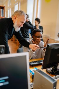 Educator supporting a student during an educational activity