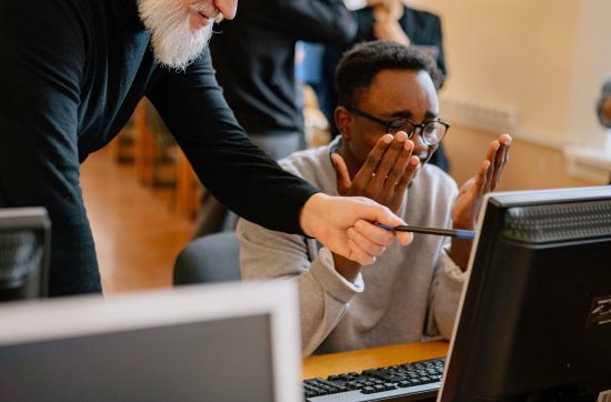 Educator supporting a student during an educational activity